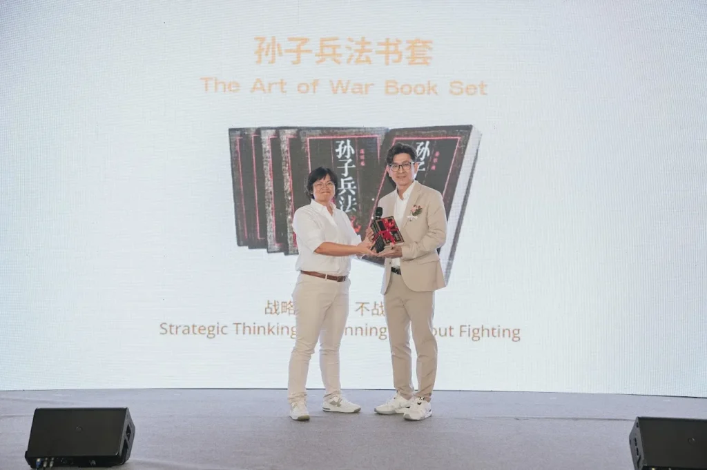 Ex Chairman Sophia Tey passes The Art of War Book Set to Mr Chang Kon Ling
